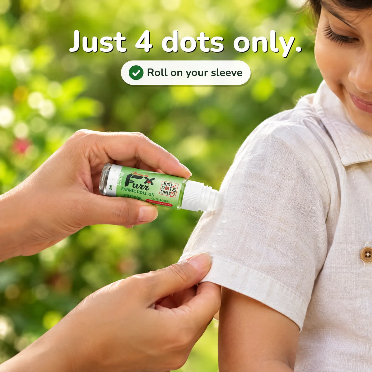 A parent rolling Mosquito Furr Fabric Roll On dots onto a child's shirt sleeve